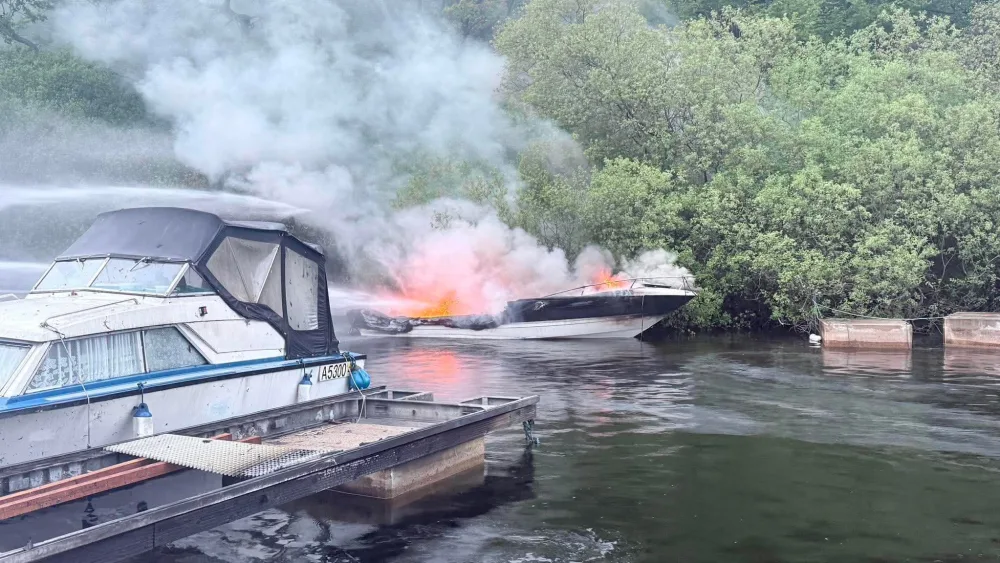 A boat caught fire on the River Leven near Balloch on Thursday evening. (Credit: Loch Lomond Rescue Boat/PA)