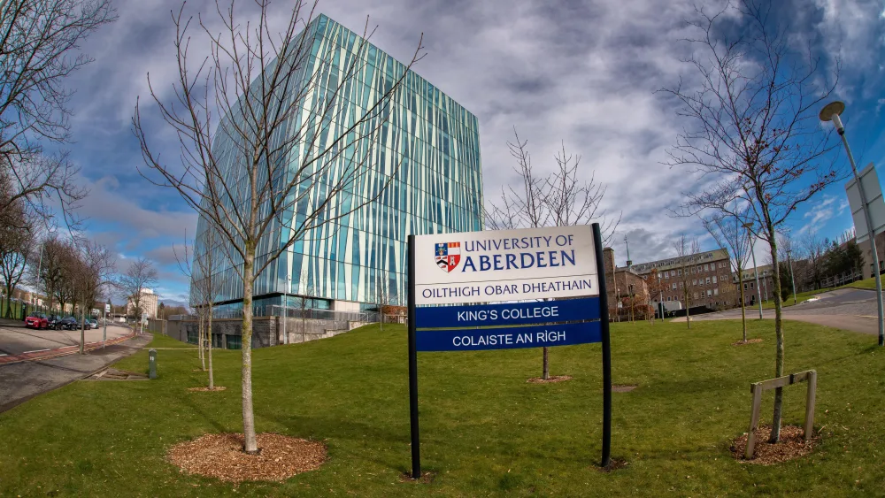 An sign for the University of Aberdeen in front of a building
