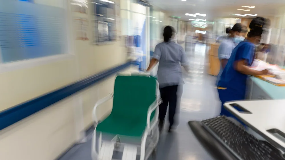 A nurse at A&E pulls a wheelchair