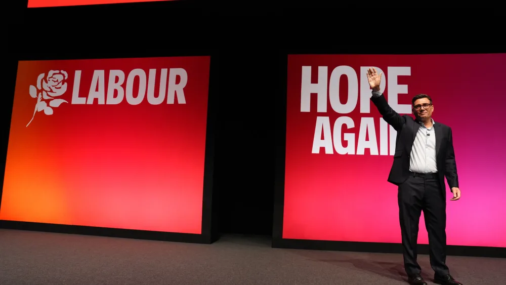 Andy Burnham waves to the audience at the Labour conference