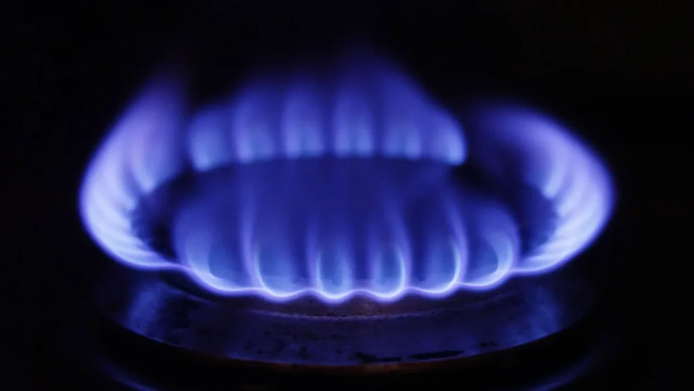 A general view of a lit gas hob