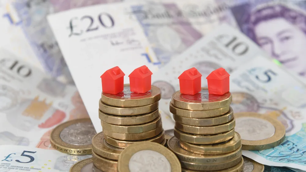 Models of homes on coins