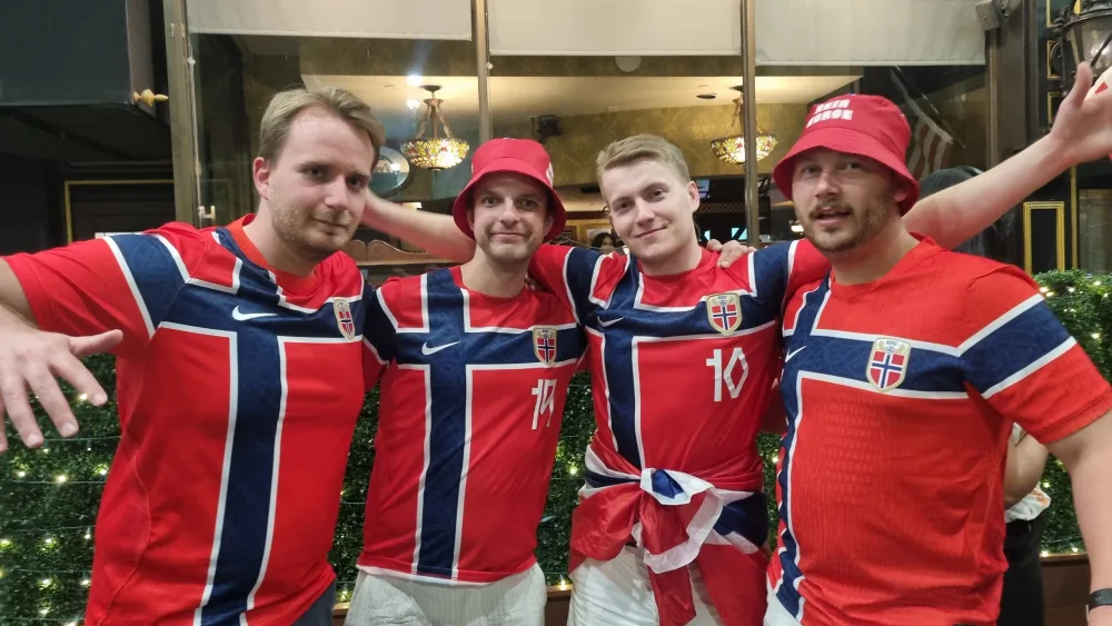 Christian Haug, left, with his friends, all wearing Norway shirts