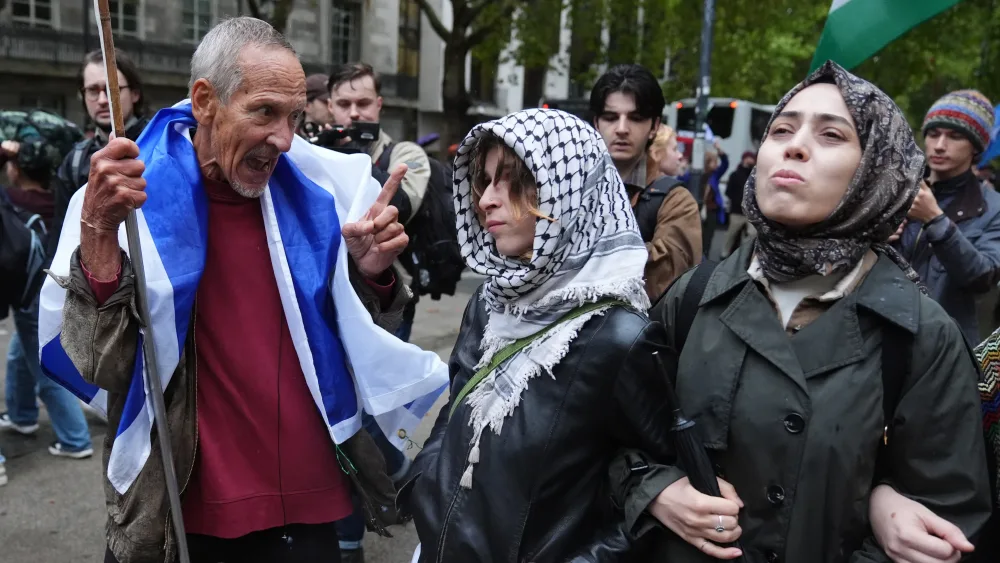 A counter-protester (left) speaking to a demonstrator as a group of students calling themselves the University of London Coalition take part in a pro -Palestine march from Kings College London in the Strand to University College London in Holborn