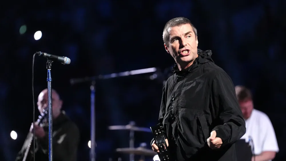 Oasis perform on stage