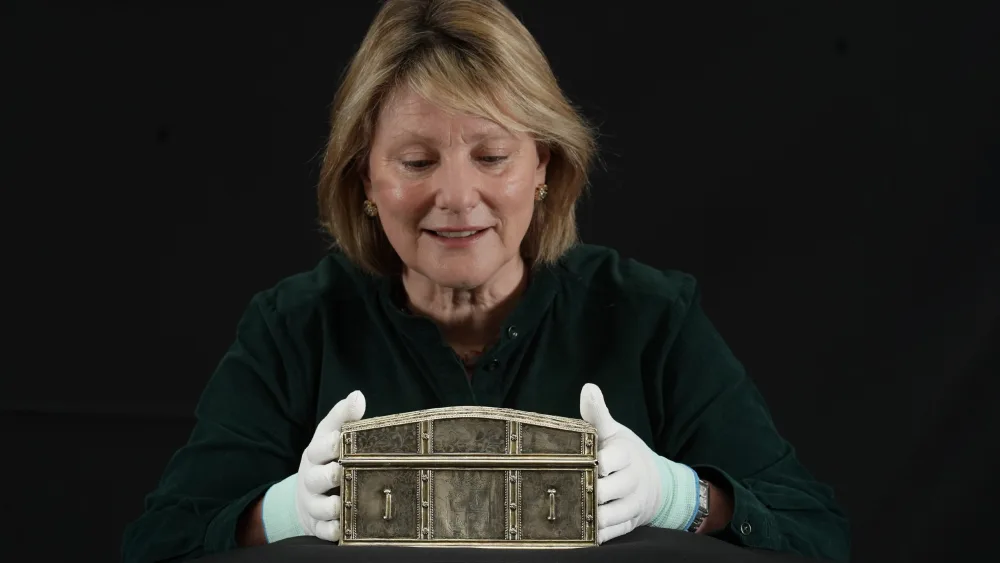 Dr Anna Groundwater with the silver casket believed to have belonged to Mary, Queen of Scots (Stewart Attwood/PA)