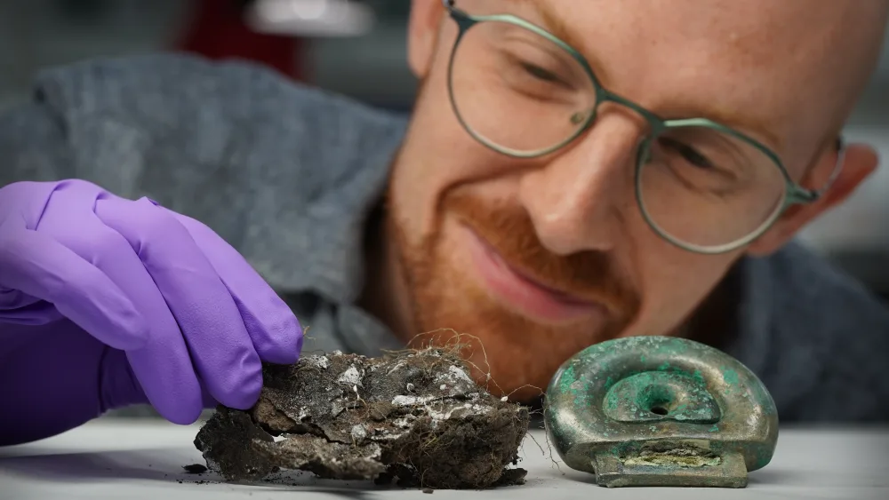 Dr Matthew Knight with some Bronze Age objects