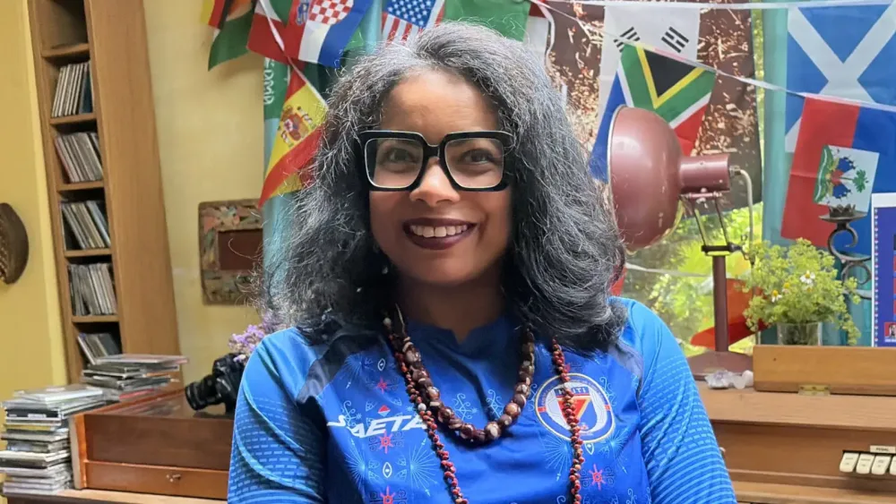 Leilani Taneus-Miller smiling while wearing a Haitian top