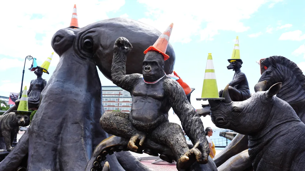 The Arms of Friendship statue adorned with traffic cones in Boston