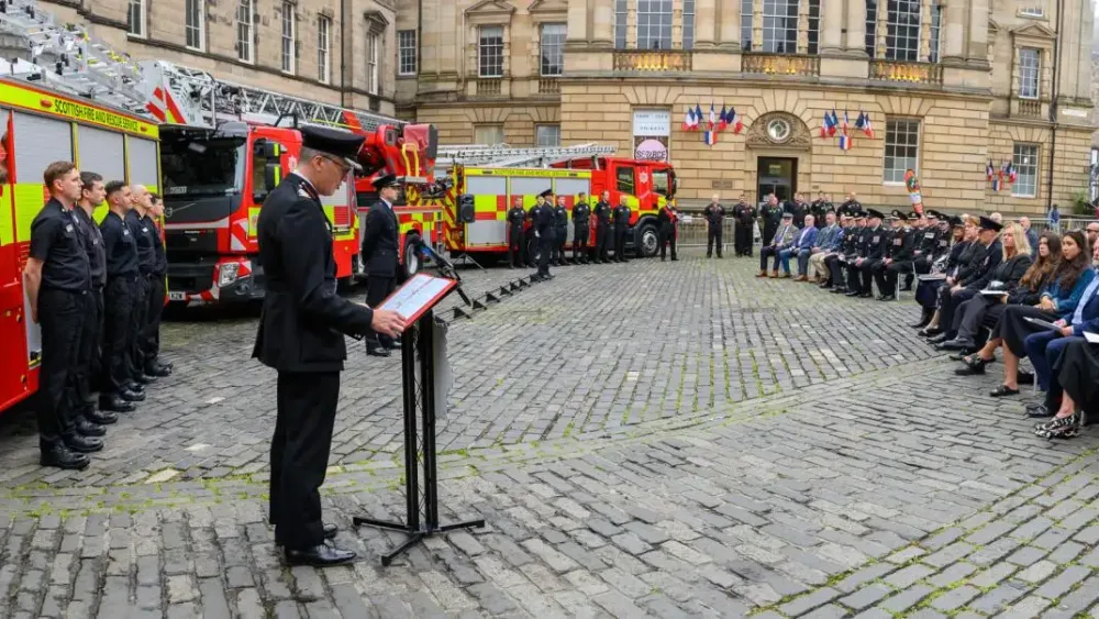 A senior firefight addressing a service to remember a fallen colleague