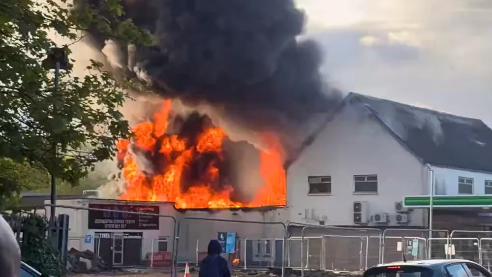 Flames billowing from a property