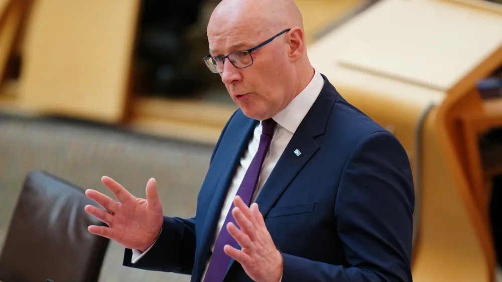 John Swinney speaks during a Scottish Parliament debate