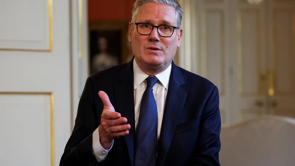 Sir Keir Starmer gesturing with one hand while speaking