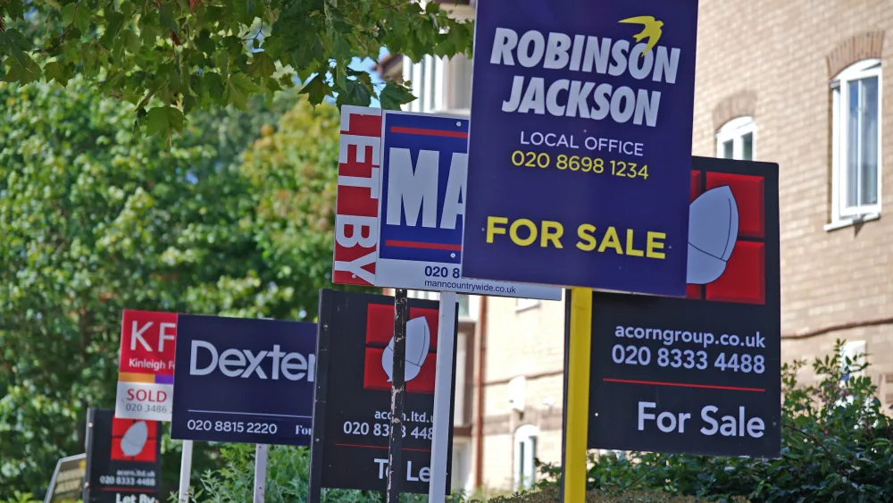 Estate agent signs outside apartments