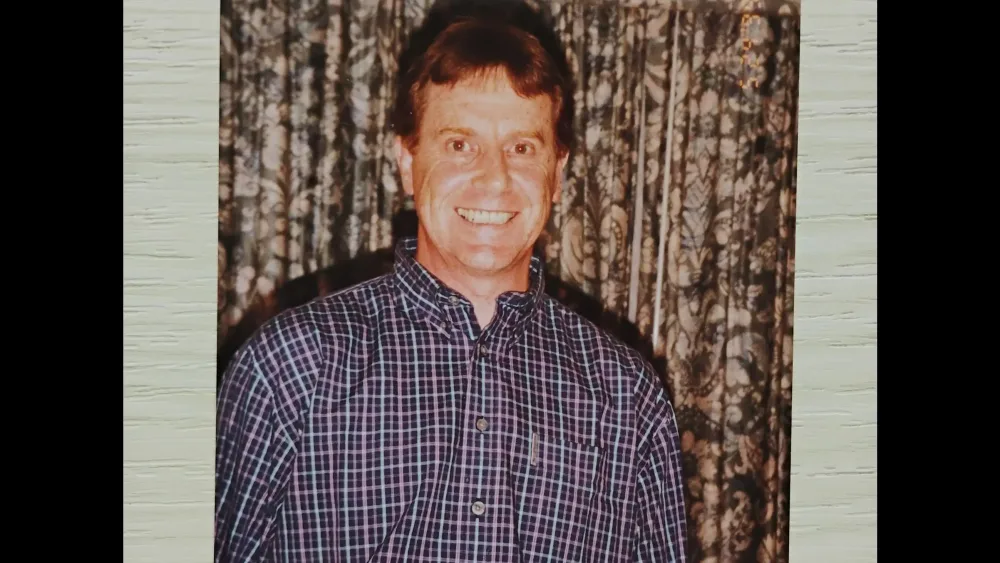 A family photo of John Gillies smiling
