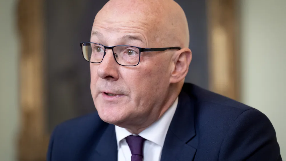 Headshot of John Swinney speaking