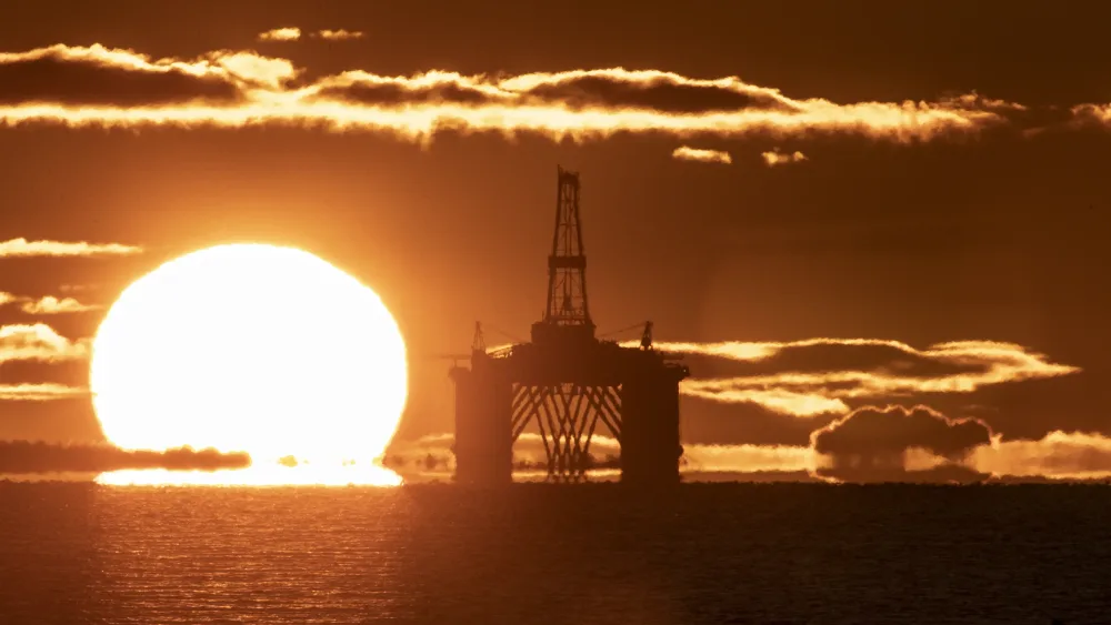 An oil rig at sunset
