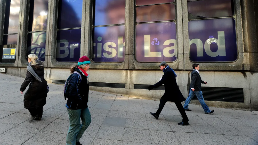 Workers walking on the pavement outside British Land offices