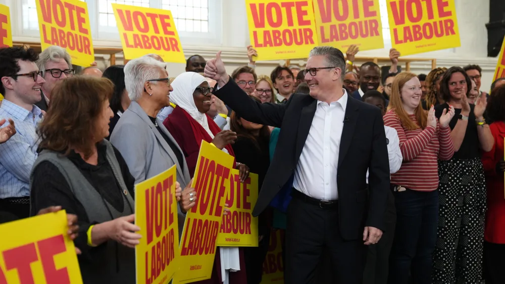 Prime Minister Sir Keir Starmer gestures to supporters during a visit to All Saints Hall in south London, whilst campaigning for the local elections on May 7
