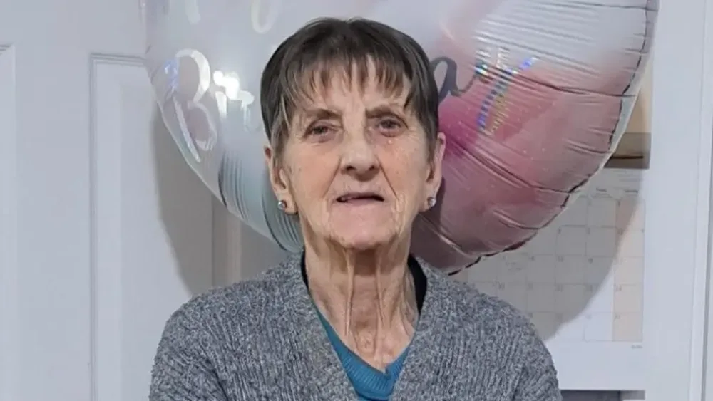 Handout photo of Elizabeth Colligan, with a large balloon behind her