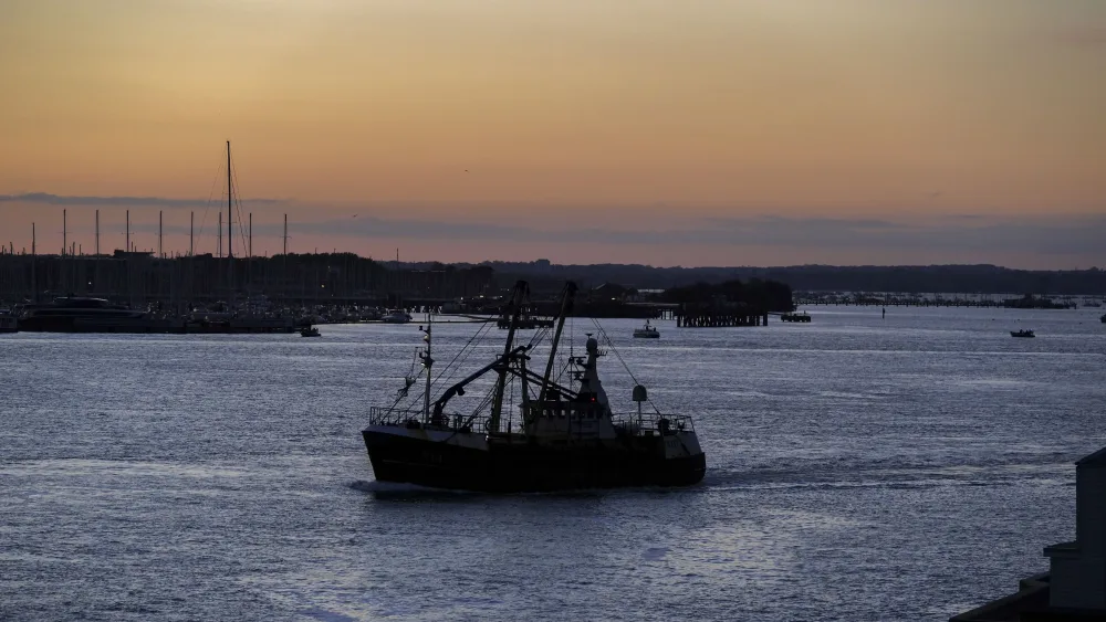 A fishing boat returning to harbour