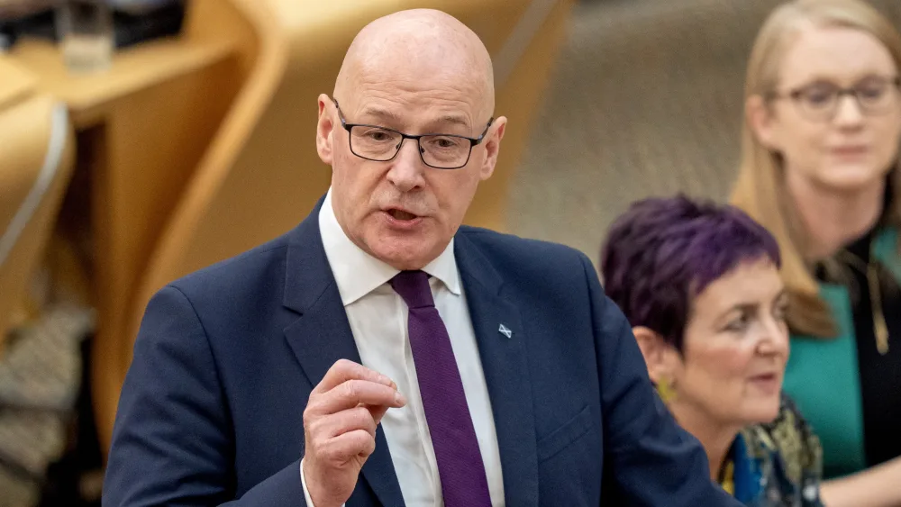 John Swinney speaks during a Holyrood debate