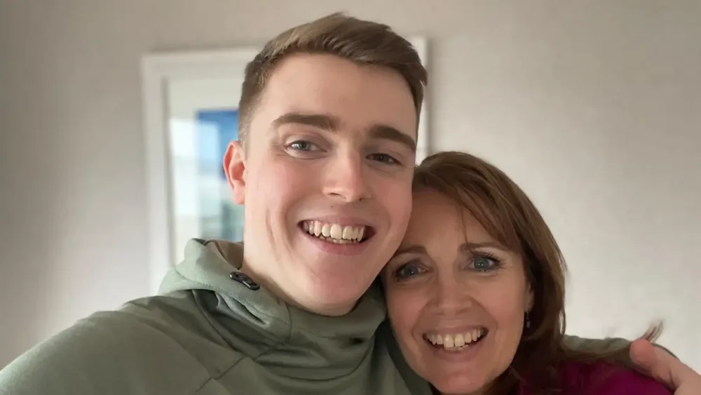 Ross Simpson smiling with his arm round his mother Gaynor