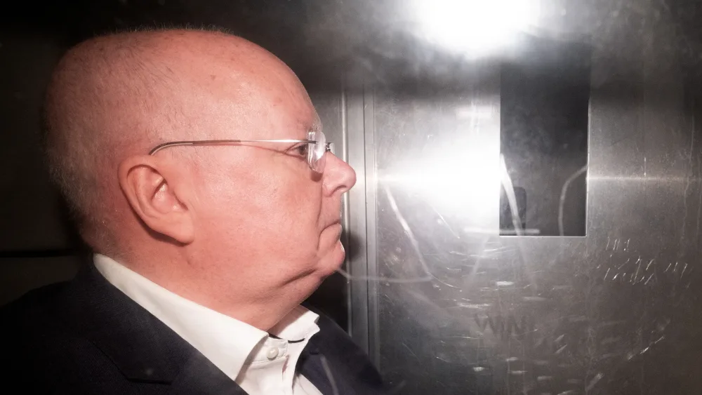 Peter Murrell pictured in the back of a prison van