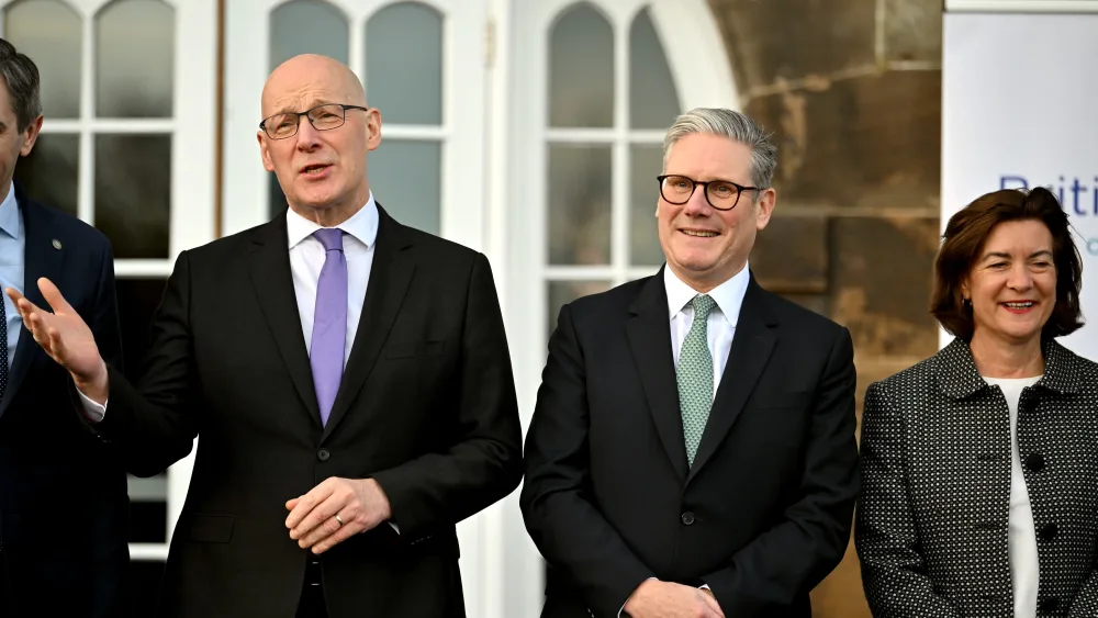 John Swinney, centre left, standing next to Keir Starmer, centre right