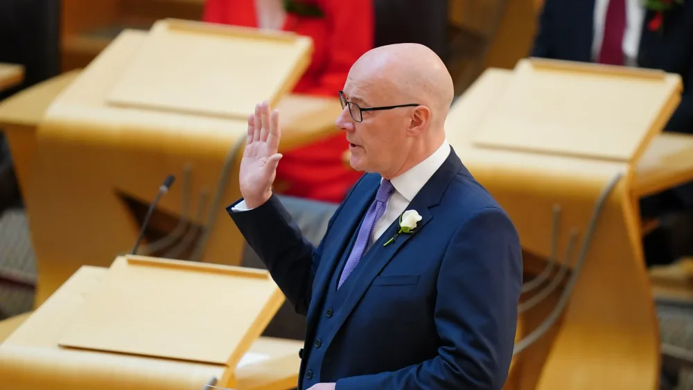 John Swinney swearing an oath in Holyrod