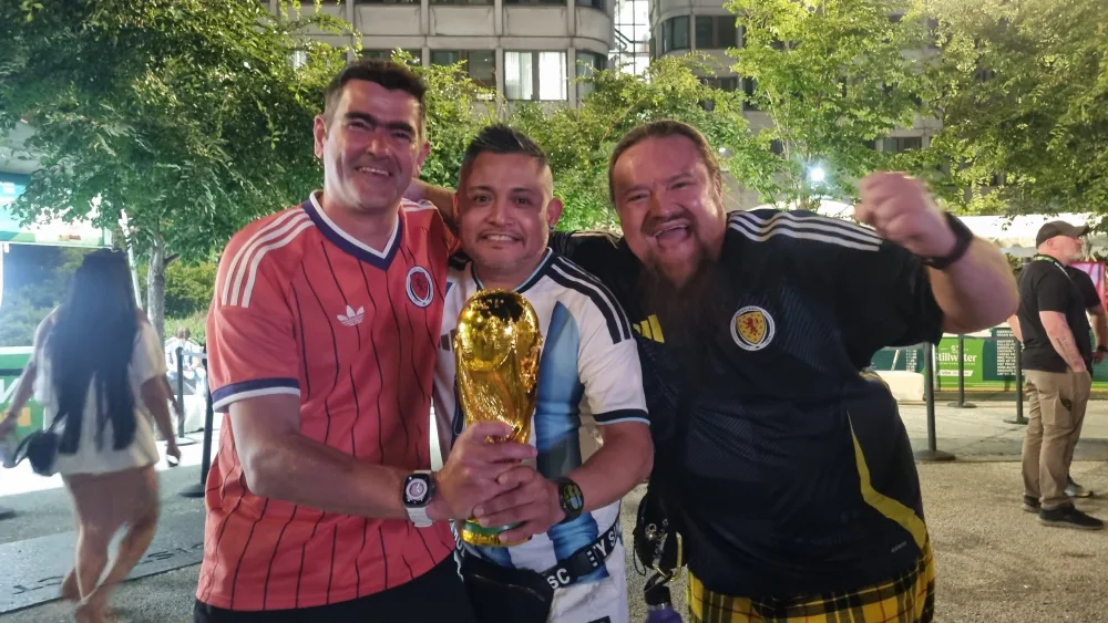 Neil Gunn, left, and Michael Bryan right, posing with a replica World Cup