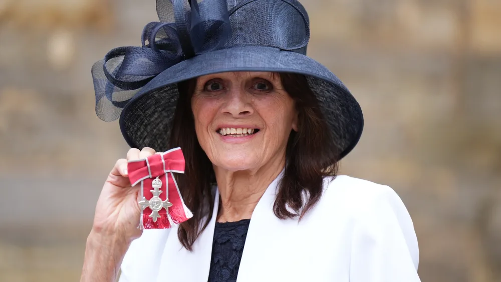 Eve Graham poses after being made an MBE