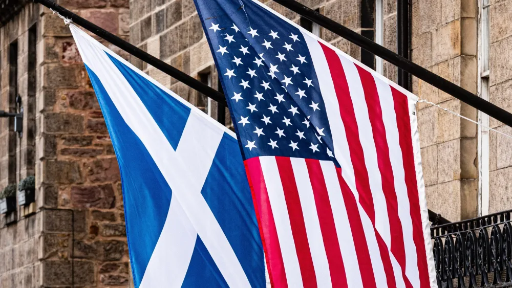 Scottish and American Flags on outside of a building in Edinburgh