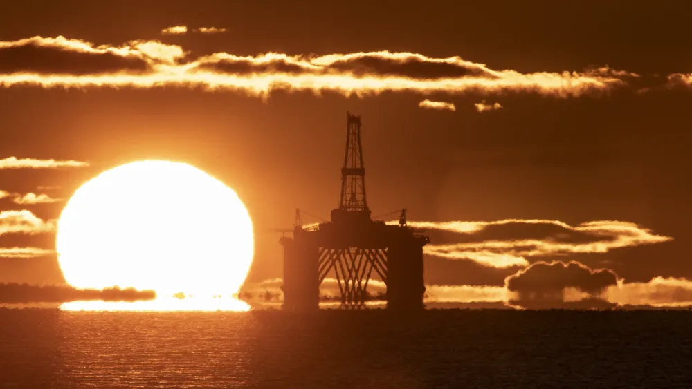 An oil rig at sunset