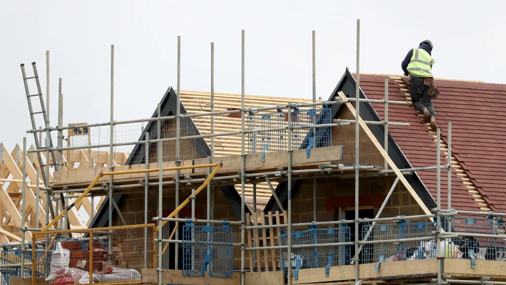 Builders work on a new housing property