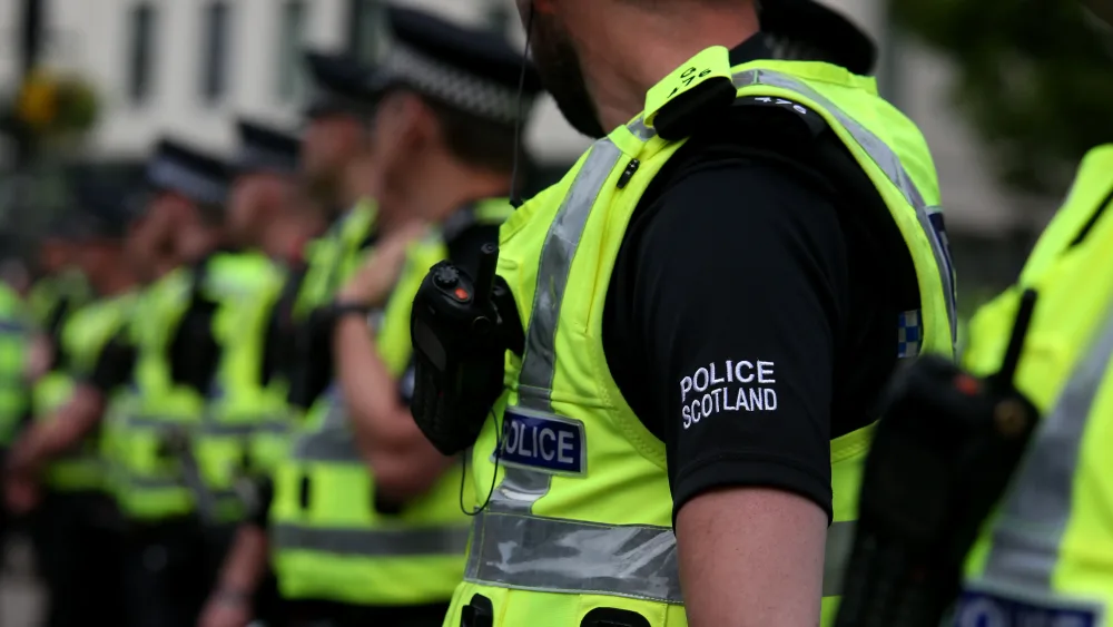 A line of Police Scotland officers in uniform