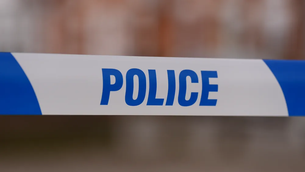 Police tape stretched over a crime scene