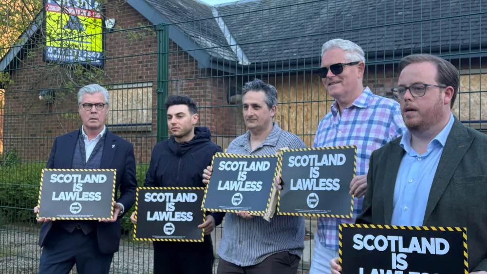 Reform UK Scottish leader Malcolm Offord (left) and candidate Thomas Kerr (right) campaigned in Castlmilk in Glasgow, where the police station has been closed down. (Katrine Bussey/PA)