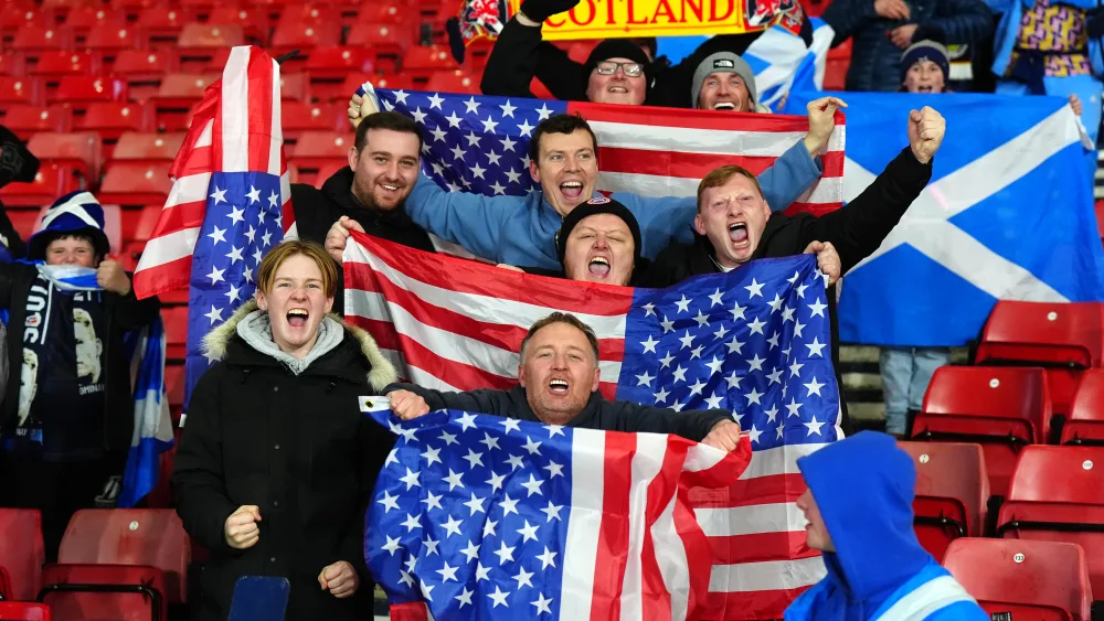 Scotland fans holding Scottish and US flags
