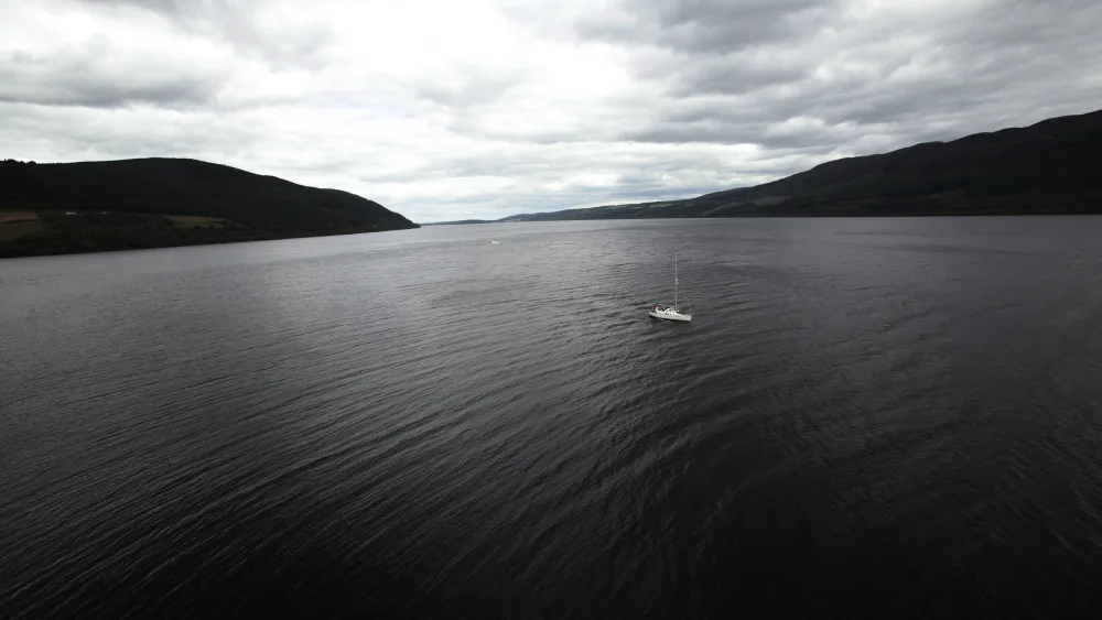 View from above of a yacht on Loch Ness