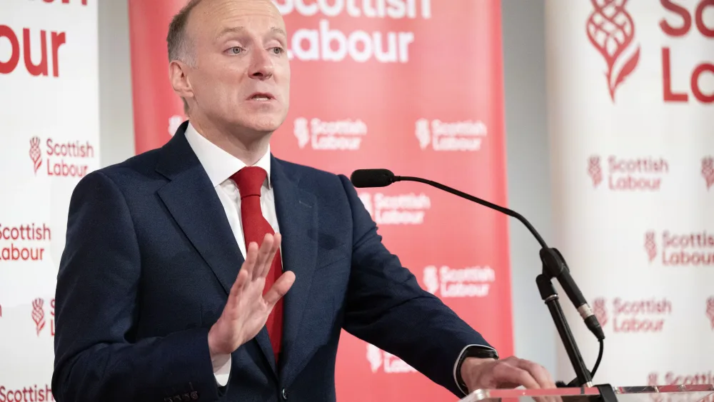 Michael Marra gesturing as he makes a speech