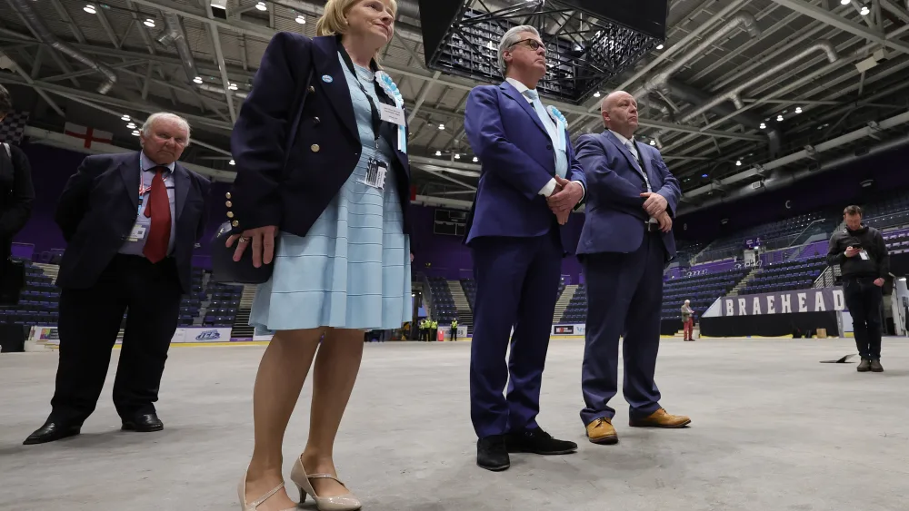 Reform UK Scotland leader Lord Malcolm Offord (centre) and David Smith (right) after being elected for West of Scotland at Braehead Arena, Glasgow, in the 2026 Holyrood elections