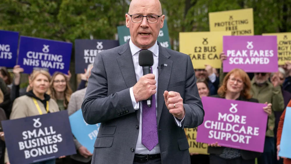 John Swinney delivers an eve-of-poll speech at a rally with SNP candidates and activists