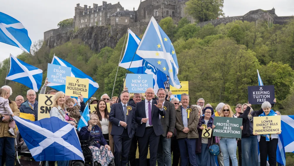 John Swinney with a group of SNP supports in front of Stirling Castle
