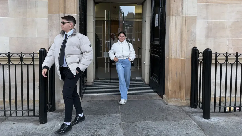 Ilia Belov and Nadjedzha Belova leaving court