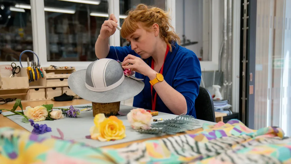 Someone making a hat at the Royal Shakespeare Company costume workshop