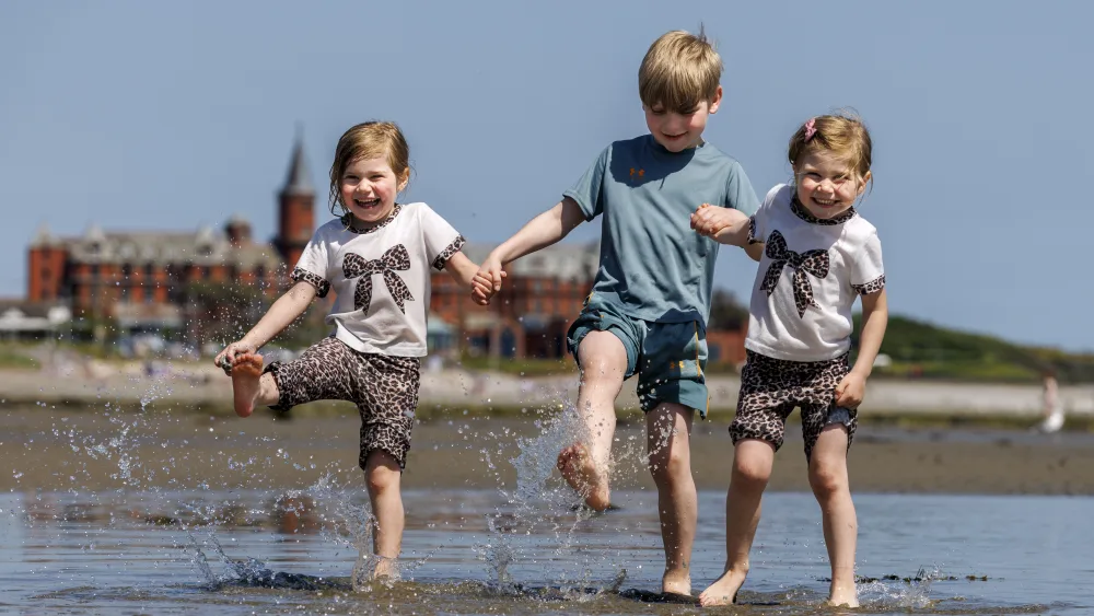 From left, Kara, Conor, and Katie McLaughlin on Newcastle beach in Co Down 