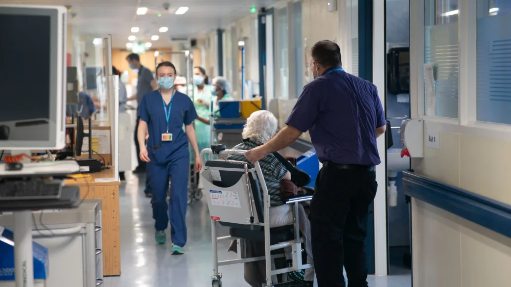Hospital patients and staff on a hospital ward