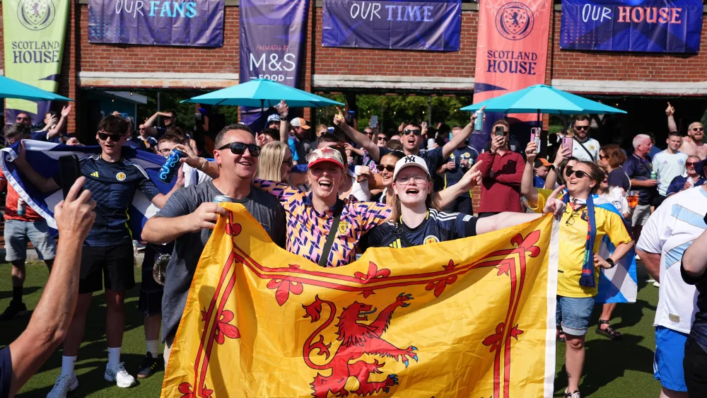 The Economy Secretary is due to fly out to join up with members of the Tartan Army in America later – but had to watch Scotland’s opening game against Haiti at home. (Martin Rickett/PA)