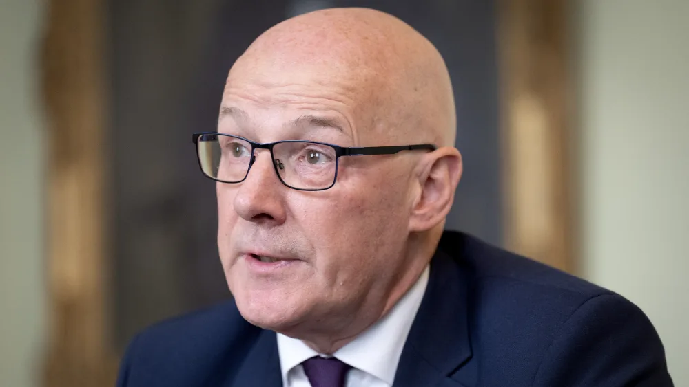 John Swinney speaking to the media